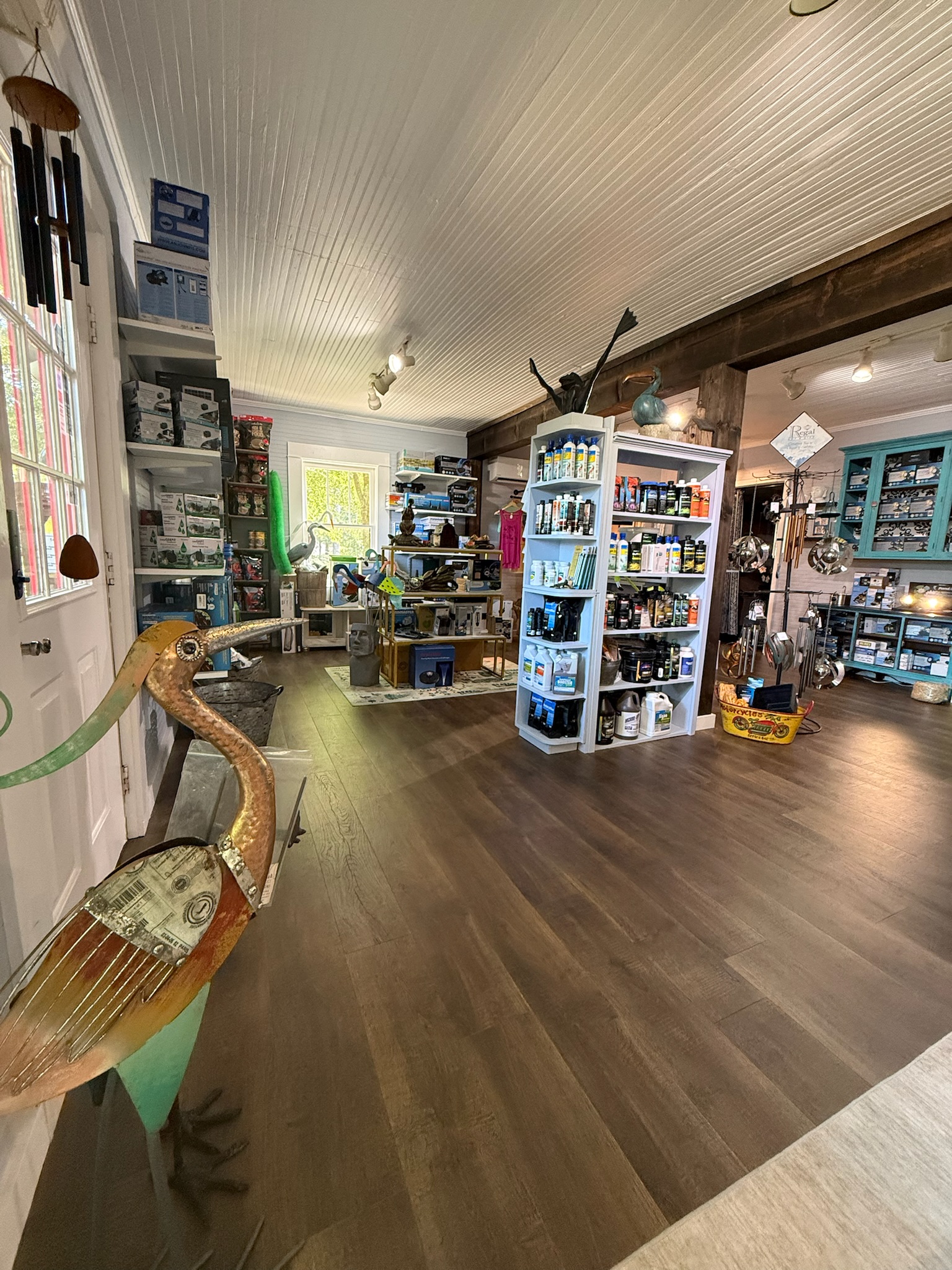 Interior of rustic gift shop with wooden sculpture